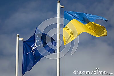 Flag of Ukraine and NATO flag Editorial Stock Photo