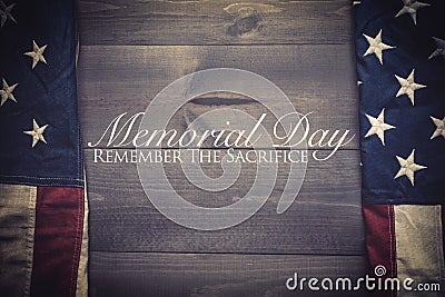 The flag of the United Sates on a grey plank background with memorial day Stock Photo