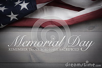 The flag of the United Sates on a grey plank background with memorial day Stock Photo
