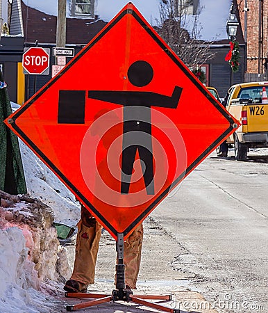 Flagman Road Work Sign Stock Photo