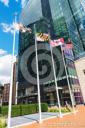 Flags of america, canada and maryland against the backdrop of Hopkins business school Editorial Stock Photo