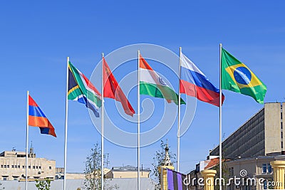 Flags of BRICS countries on a sunny summer morning against blue sky Stock Photo