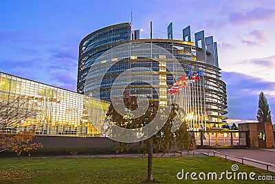 Flags of European Union countries before the European Parliament building Editorial Stock Photo