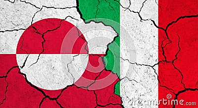 Flags of Greenland and Italy on cracked surface Stock Photo