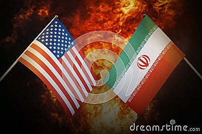 Flags of iran and United States of america against background of a fiery explosion. The concept of enmity and war Stock Photo