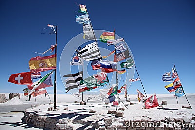 Flags of many countries in a salt desert of Salar de Uyuni Stock Photo