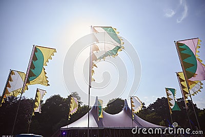 Flags And Marquee At Outdoor Music Festival Stock Photo