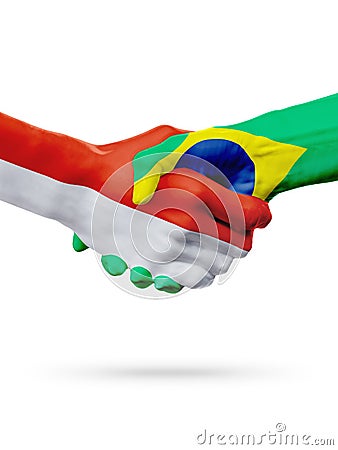 Flags Monaco, Brazil countries, partnership friendship handshake concept. Stock Photo