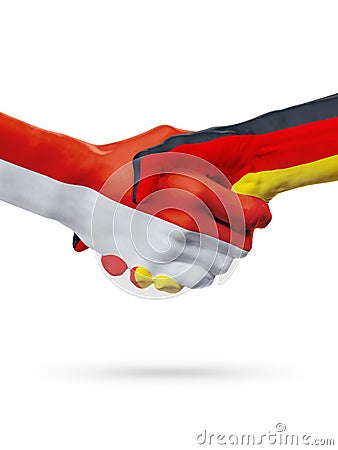 Flags Monaco, Germany countries, partnership friendship handshake concept. Stock Photo