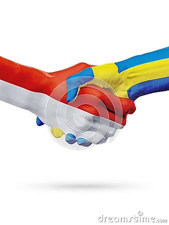 Flags Monaco, Sweden countries, partnership friendship handshake concept. Stock Photo