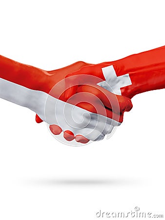Flags Monaco, Switzerland countries, partnership friendship handshake concept. Stock Photo