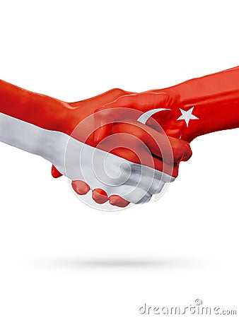 Flags Monaco, Turkey countries, partnership friendship handshake concept. Stock Photo