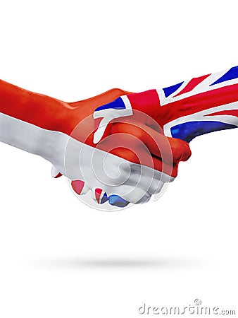 Flags Monaco, United Kingdom countries, partnership friendship handshake concept. Stock Photo