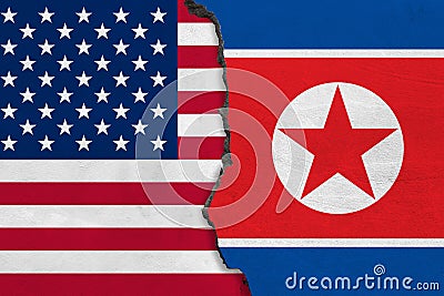 Flags of North Korea and USA painted on cracked wall. Stock Photo