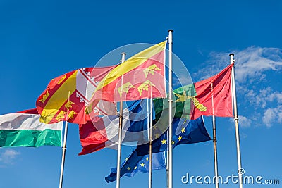 Flags on Place Rapp square, Colmar. Colmar is the third-largest commune of the Alsace region in north-eastern France, renowned for Stock Photo