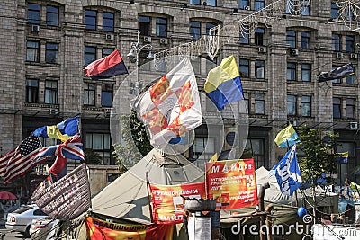 Flags of Ukraine and Banderites waiving over a tent of the Euromaidan barricades on Maidan square, during the end of revolution Editorial Stock Photo