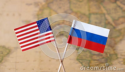 Flags of the USA and Russia over the world map, political leader countries concept image Stock Photo