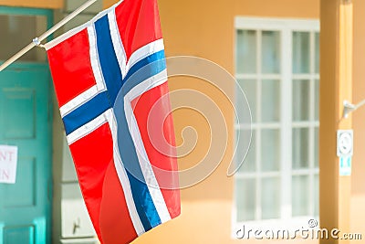 Flags on wall of building in Trondheim, Norway. Stock Photo