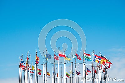 Flags of the world on flagpoles, copy space Stock Photo