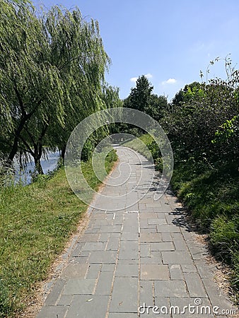 Flagstone road in the park Stock Photo