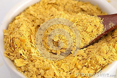 Flakes of Yellow Nutritional Yeast a Cheese Substitute and Seasoning for Vegan Diets Stock Photo