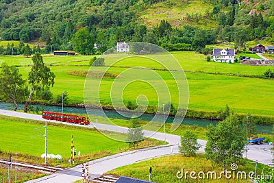 Flam, Norway red train tour in green valley Stock Photo