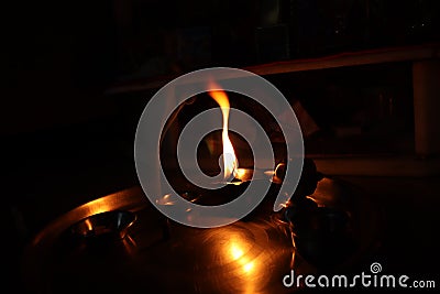 Flame light prayer devotional dark background Stock Photo