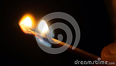 Flame of the match burning in fingers Stock Photo