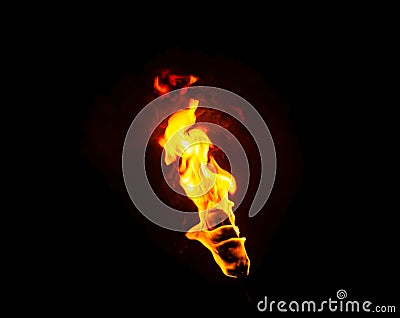 Flame of a torch in the dark Stock Photo