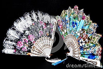 Flamenco hand fan with colorful pattern isolated on black background Stock Photo