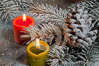 Flaming candles with Christmas twig Stock Photo