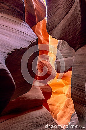 Flaming sandstones stacked into flaky fire waves in a sand maze in Lower Antelope Canyon in Page Arizona Stock Photo