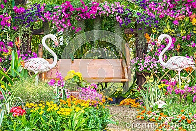 Flamingo Bird statue in flower garden. Stock Photo