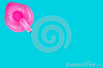 Flamingo isolated. Inflatable ring toy isolated on blue background. Summer pool. Stock Photo