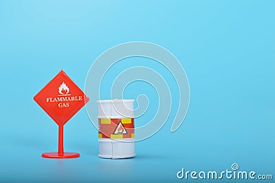 Flammable liquid gas warning sign isolated on a blue background Stock Photo