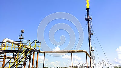 Flare for flaring associated gas. The end point of the pressure relief system on the oil Stock Photo