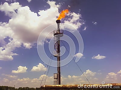 Flare for flaring associated gas. The end of the pressure relief system on the oil facility Stock Photo