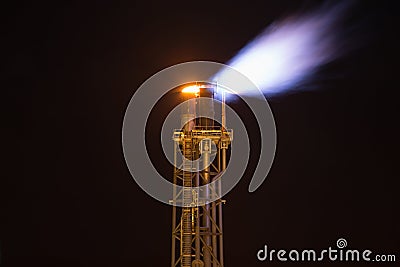 Flare stack platform while burning gases from processing at oil and gas platfom to prevent over pressure and burn toxic gas Stock Photo