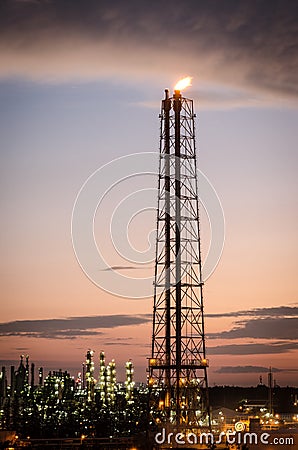 Flare stack at oil refinery Stock Photo