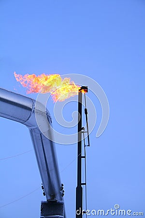 Flare stack with pipe on left Stock Photo