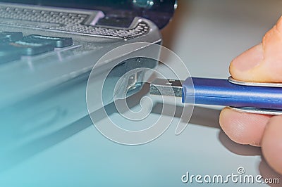 Flash drive conected to laptop Stock Photo