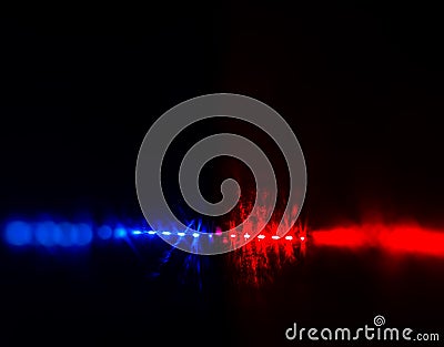 Flashing red and blue police car lights in night time. Stock Photo