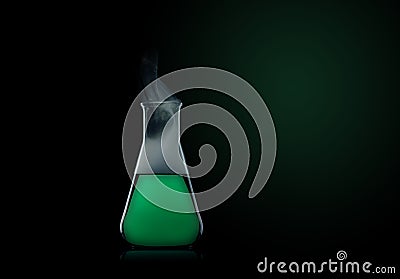 Flask with green liquid Stock Photo