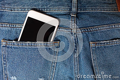 Flat background with copy space. Top view of casual woman outfit, jeans and headphones Stock Photo