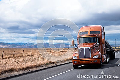 Flat bed semi truck transporting cargo under cover on California Stock Photo