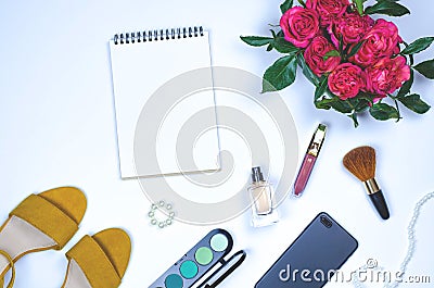 Fletley of flowers, notebook, cosmetics, smartphone and women`s stuff Stock Photo