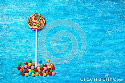 Flat lay of beautiful multicolored lollipop and sweet bonbons on Stock Photo