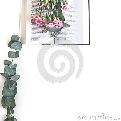 Flat lay: Bible and pink, red, rose flower bouquet. On white background Stock Photo