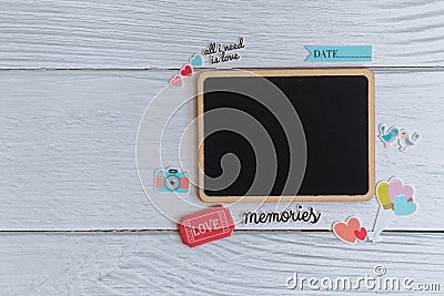 Flat lay black plain wooden tag decorate with stickers on white wooden background Stock Photo