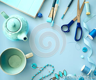 Flat lay blue color objects and accessories frame on light blue background Stock Photo